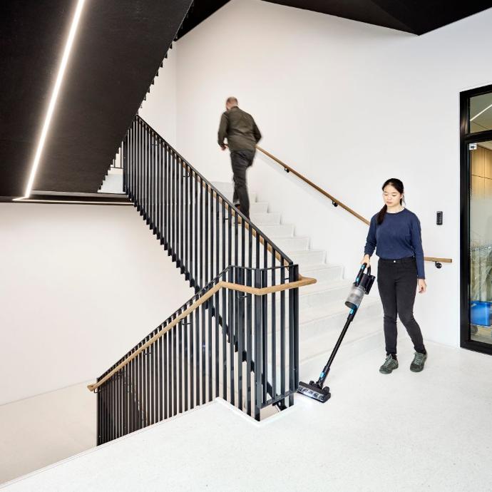 Nilfisk VU200 Cordless Vacuum Cleaning Stairs Nilfisk VU200 Cordless Vacuum Cleaning Stairs