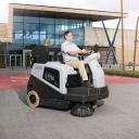 SW5500 Ride-On Sweeper Cleaning Outdoor Area